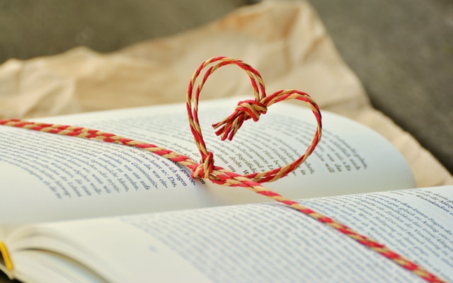 Book with heart shaped string